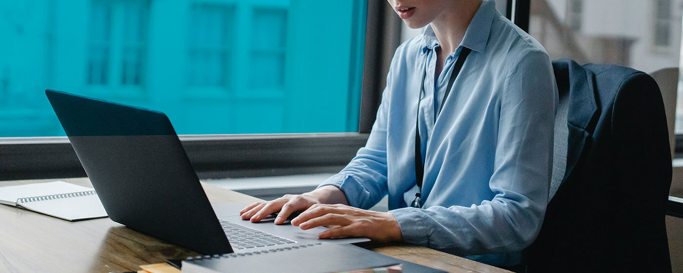 woman-working-on-laptop atlas business academy in greece